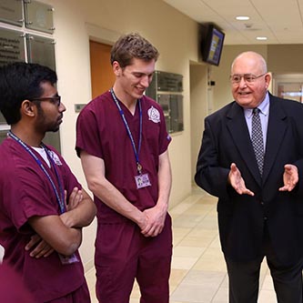 Dr. Andrews converses with Dentistry students