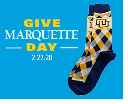 Give Marquette Day wordmark and MU socks